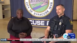Syracuse cop helps woman carrying food pantry groceries in the freezing cold