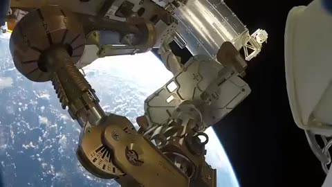 NASA Astronauts Space Walk Outside the ISS.