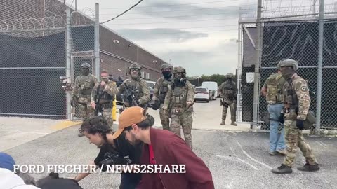 Mayodumpster protester blocking the entrance to the ICE facility in Chicago