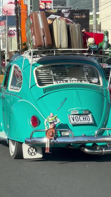 Woody and Buzz in a Predicament on a VW Beetle