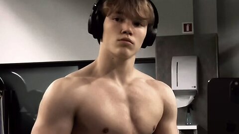 15 years old teen boy flexing muscles