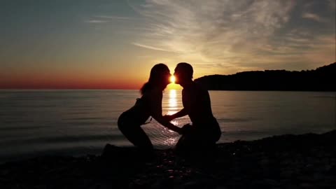 Couple Kissing Very Romantic At Beach Sunset