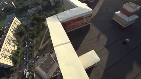 Parkour runner misses his jump and falls off a high rise rooftop, Darwin Award