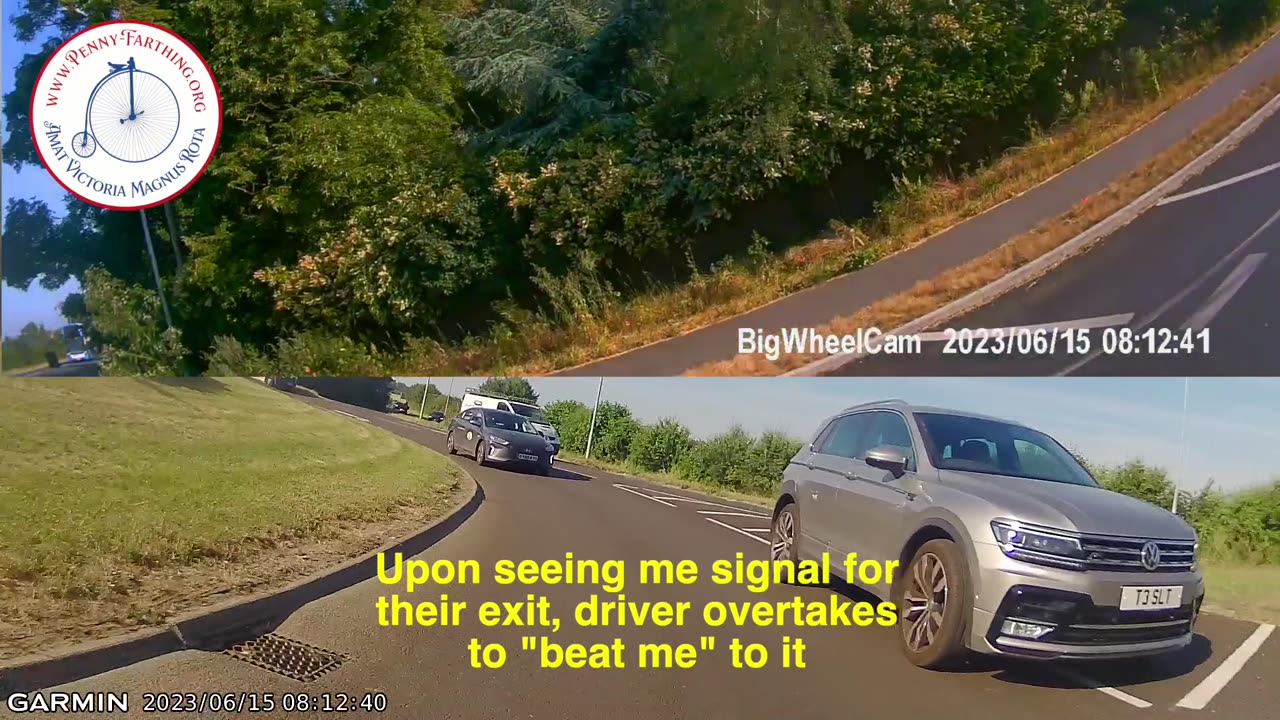 Aggressive driver under-takes Penny-Farthing over hashed markings in roundabout
