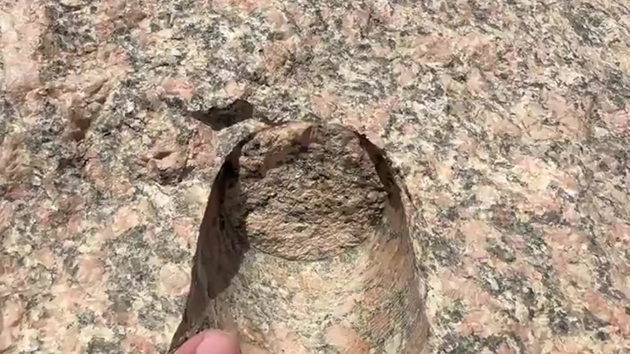 Interesting Rose-Granite Block with a strange indentation in it.