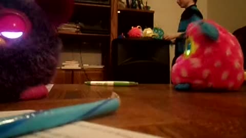 Jonny dances with Furbys
