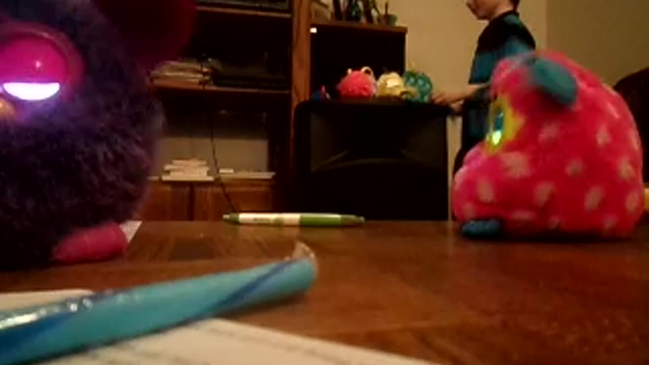 Jonny dances with Furbys