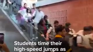 Students at a university in Bangladesh were forced to carefully time their jumps off an escalator
