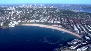 Hundreds of surfers and swimmers paddle out in honor of Bondi victims