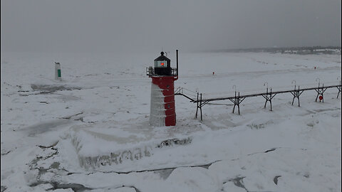 Ice-Covered Lighthouses Amid Winter Chill on Lake Michigan
