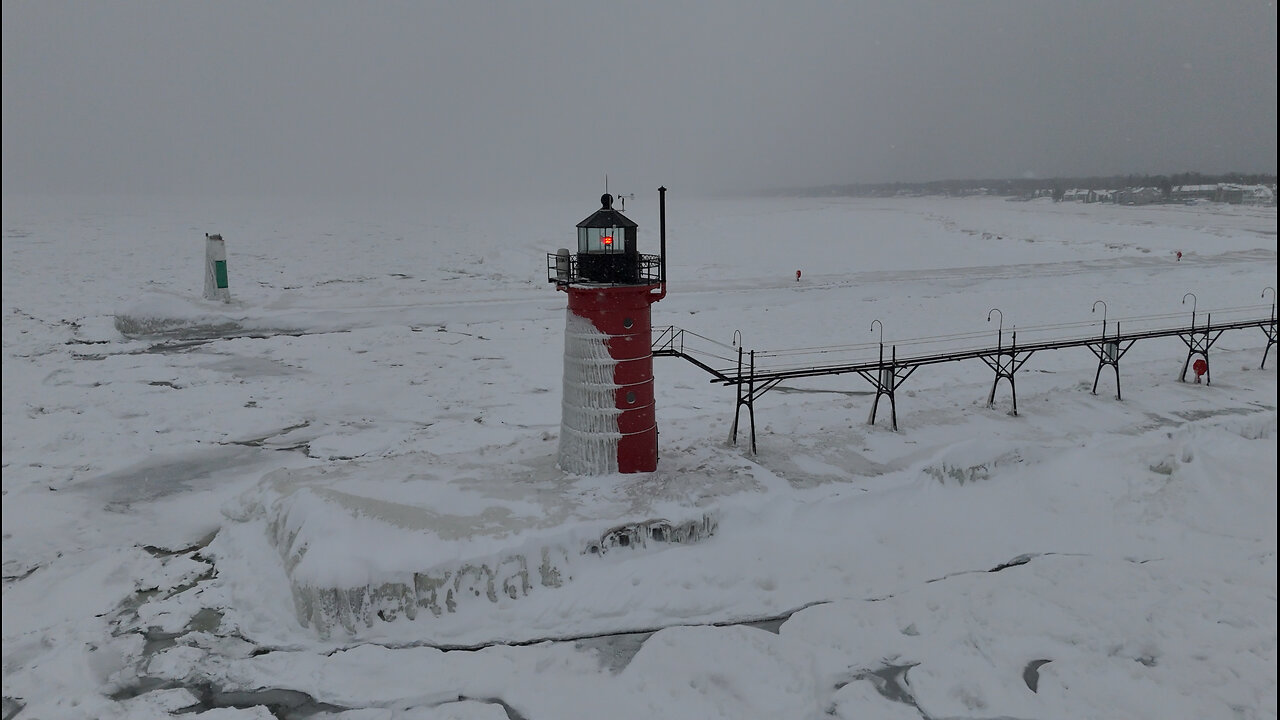 Ice-Covered Lighthouses Amid Winter Chill on Lake Michigan
