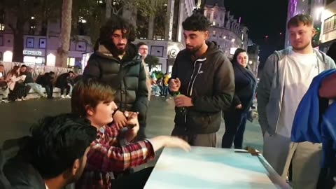 Gang of muslims interrupt the debate stand in Leicester Square. Yeah...