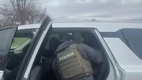 Four agents vs. one guy who really didn’t want to leave. Two-minute wrestling match on the grass.