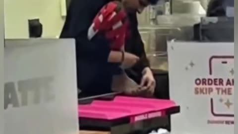 CAUGHT ON CAMERA: A H1-B Indian Dunkin Donuts employee clips his toenails at a food prep table!