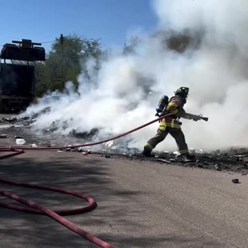FIREFIGHTERS WORKED TO QUICKLY EXTINGUISH THE CONTENTS OF THE TRUCK