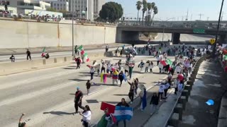 A large group of illegal aliens have walked onto the southbound lanes of the 101 Freeway