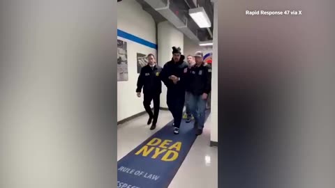 Maduro walks hallway at US drug enforcement agency after detention