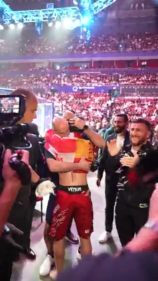 Aleksandre Topuria celebrating his win alongside Merab Dvalishvili,