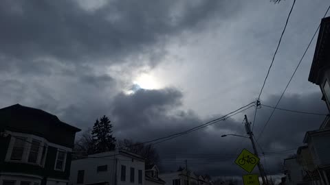 The white sun and yellow sun's light coming through the "clouds"
