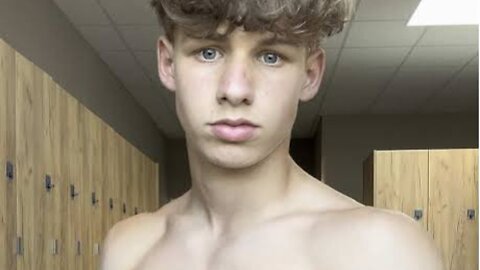 Handsome muscular teen boy flexing muscles