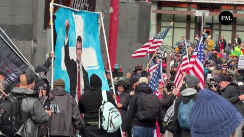 Wow. A group of America lovers arrive with a large Charlie Kirk painting outside