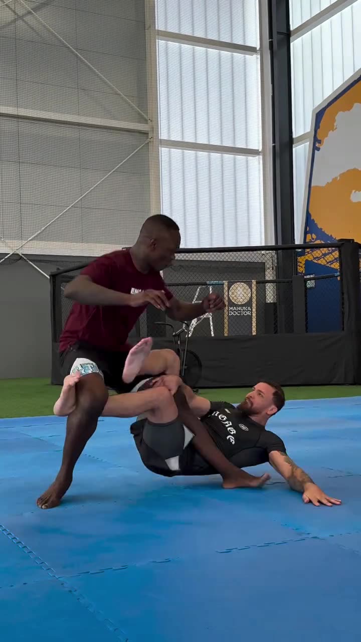 Mauricio Ruffy Shows Israel Adesanya His Leg Scissors Takedown