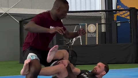 Mauricio Ruffy Shows Israel Adesanya His Leg Scissors Takedown 