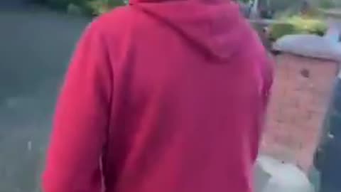 A far left extremist threatens an Irishman for putting up an Irish Tri colour.