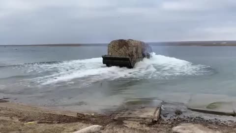 A Russian amphibious PTS 2 crosses water. Kherson direction.