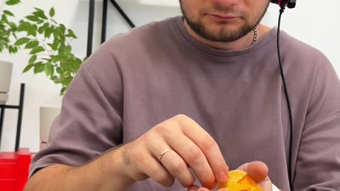 Man Uses Dog's Toes To Hold Chips