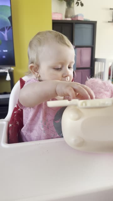 baby playing with her toy dog... a bit more focused