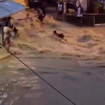 This woman almost taken by raging floodwaters in Bella Colinas