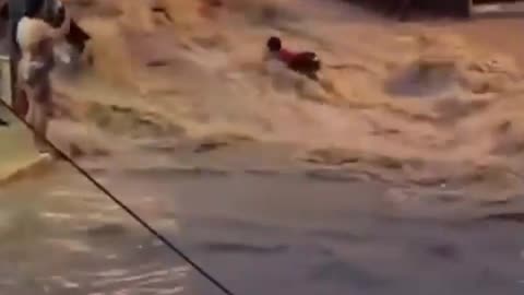 This woman almost taken by raging floodwaters in Bella Colinas