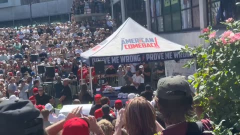 Charlie Kirk got shot through the roof of the tent. Look at the M in American! A drone did it!