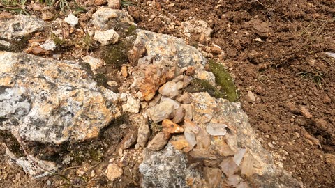 Joking around in Quechua while mining quartz in the mountains