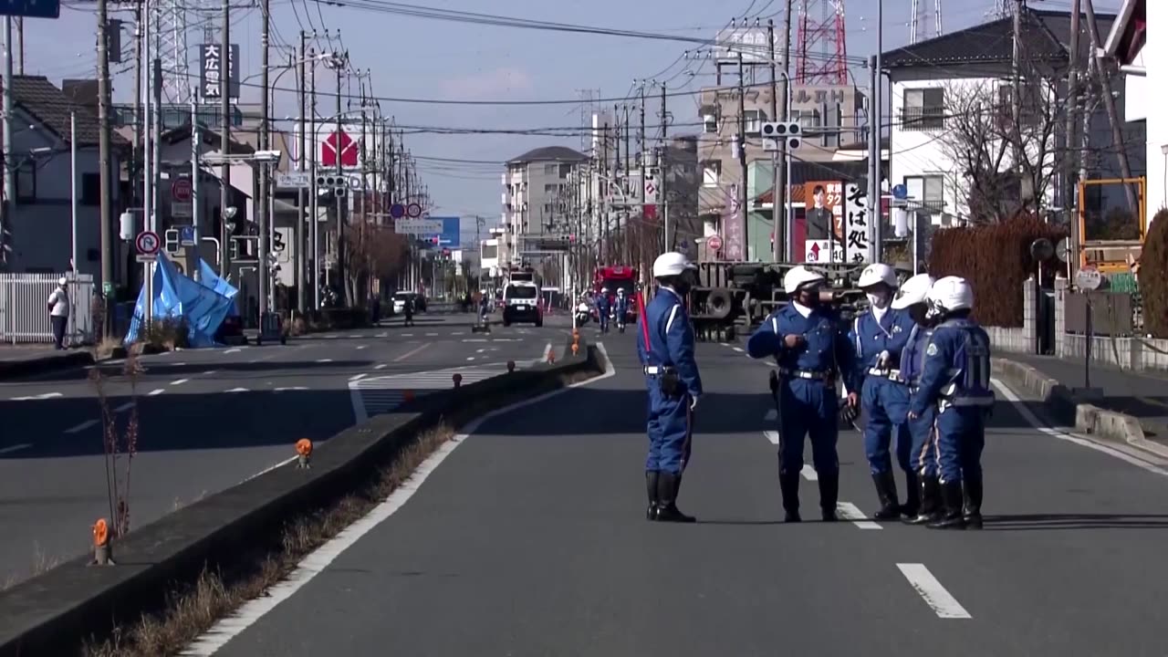 Rescuers attempt to recover truck swallowed by sinkhole in Japan