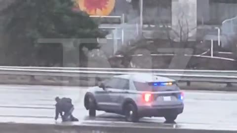 Seattle: Man yanks female police officer out of her car, gets in, and drives off.