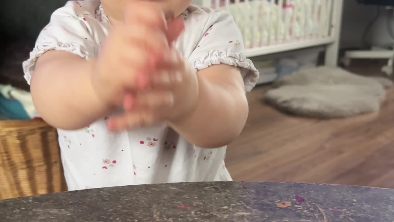 Baby Kayla having fun with a scrunchie! 😂