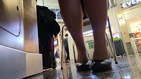 Operation Airhose - under table view of shoeplay and legs