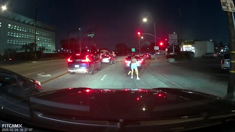 Two Women's Physical Altercation Spills Into Street Traffic