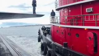 How to get off of a submarine onto a Tugboat
