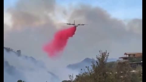 Tanker drops over the Palisades fire in Los Angeles