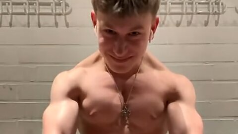 16 years old teen boy flexing muscles