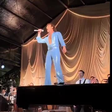 Zuckerberg rips off his suit, performing in a blue jumpsuit, wife's 40th birthday party