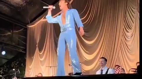 Zuckerberg rips off his suit, performing in a blue jumpsuit, wife's 40th birthday party