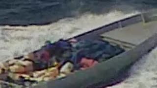 What a Shot! Sniper Takes Out Drug Boat's Motor Firing from a Helicopter