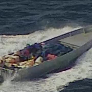 What a Shot! Sniper Takes Out Drug Boat's Motor Firing from a Helicopter