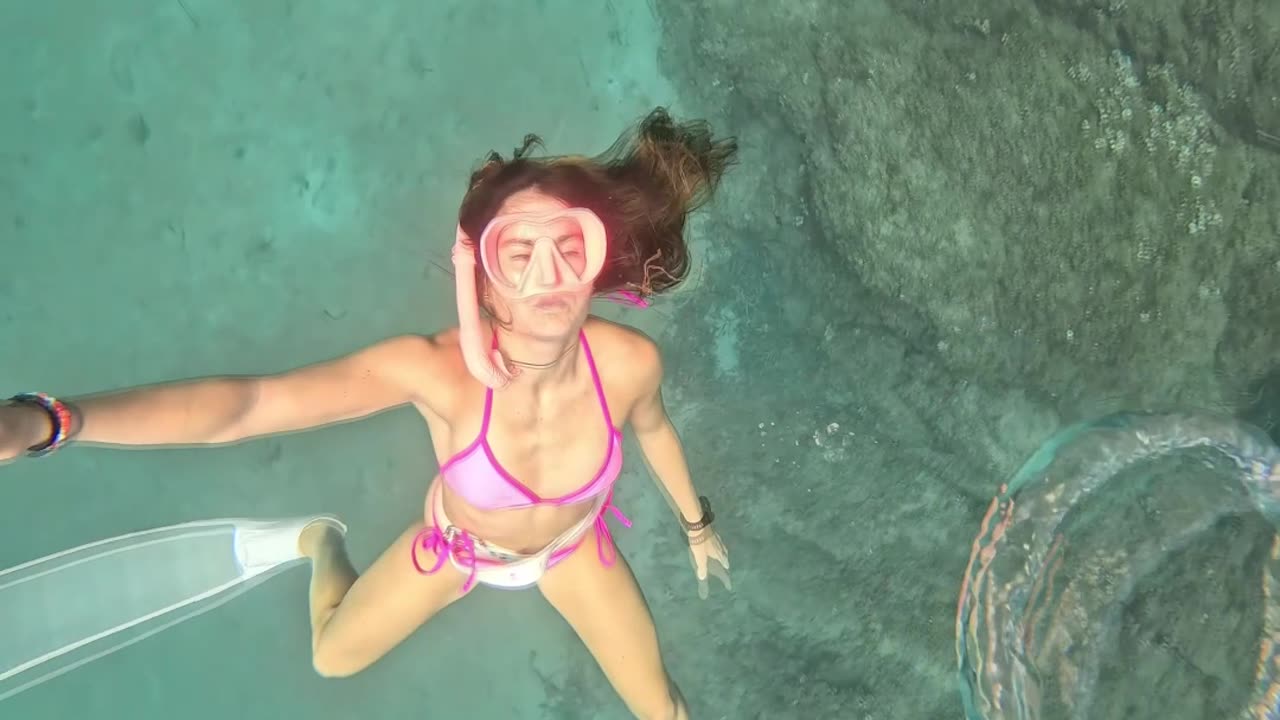 Woman Blows Underwater Bubble Ring