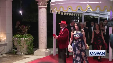 Still more badly dressed people arrive at the Mar A Lago New Years Gala