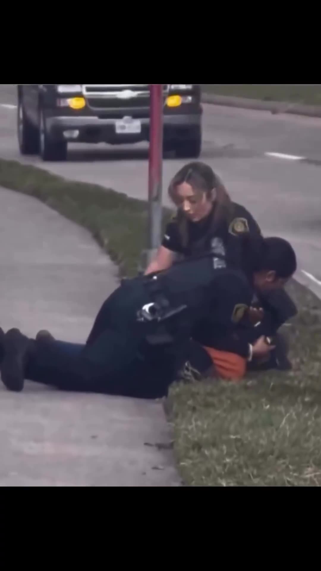 Two Houston female police officers arrest a suspect.